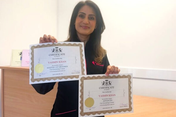 Yasmin Khan with certificates