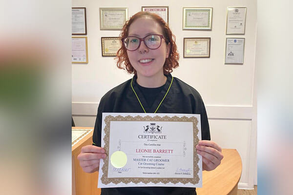 Leo Barrett with certificates